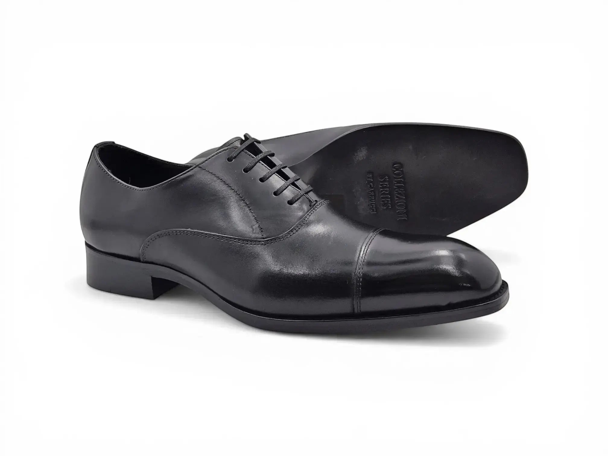Carrucci Shoes black leather cap toe Oxford dress shoes with leather sole. Classic closed-lace design for formal wear.