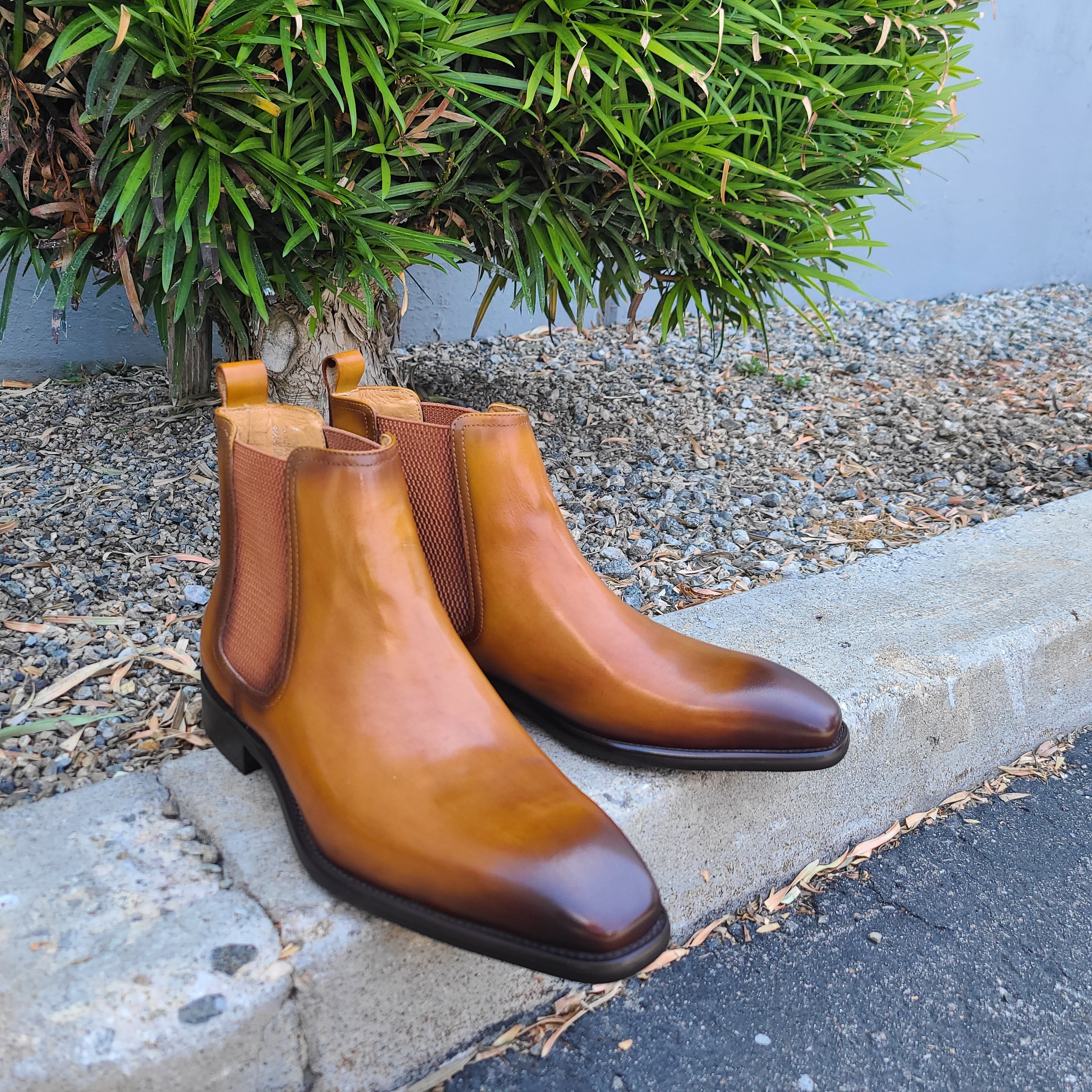 A pair of Cognac color boots
