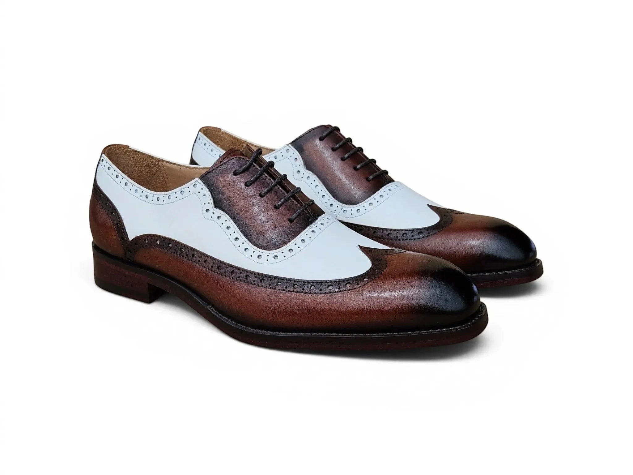 Carrucci Shoes Alex two-tone wingtip oxford in brown and white calfskin with brogue detailing and leather outsole.