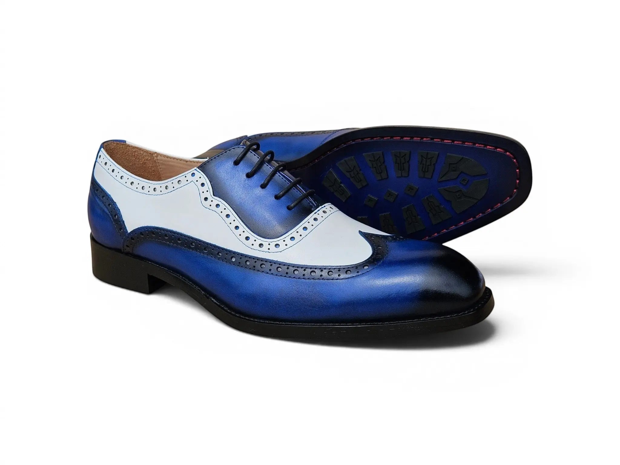 Carrucci Shoes Alex two-tone blue and white calfskin wingtip oxford with brogue detailing and leather outsole.