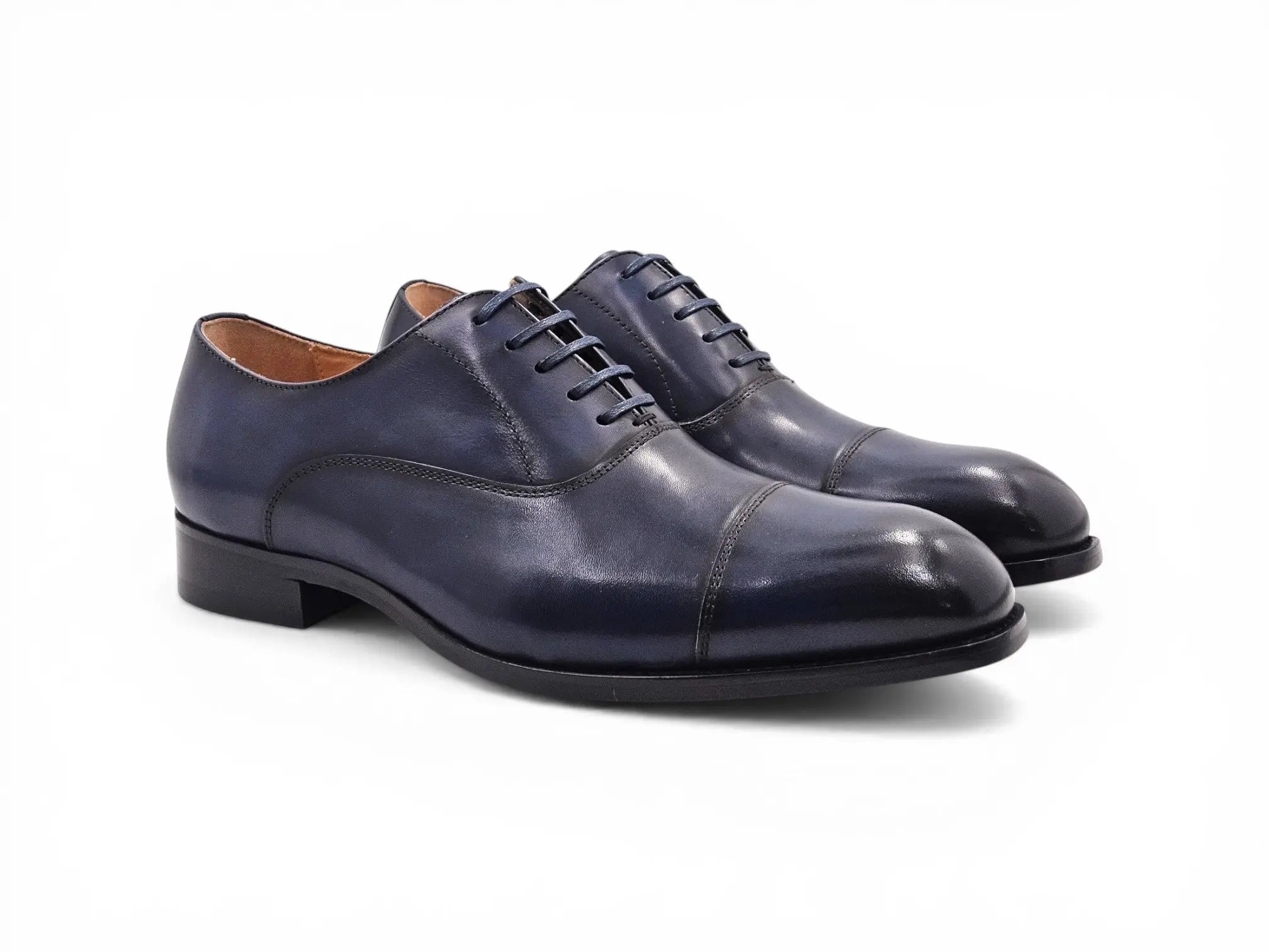 Carrucci Shoes navy blue leather cap toe oxford dress shoes with leather sole and closed-lace construction.