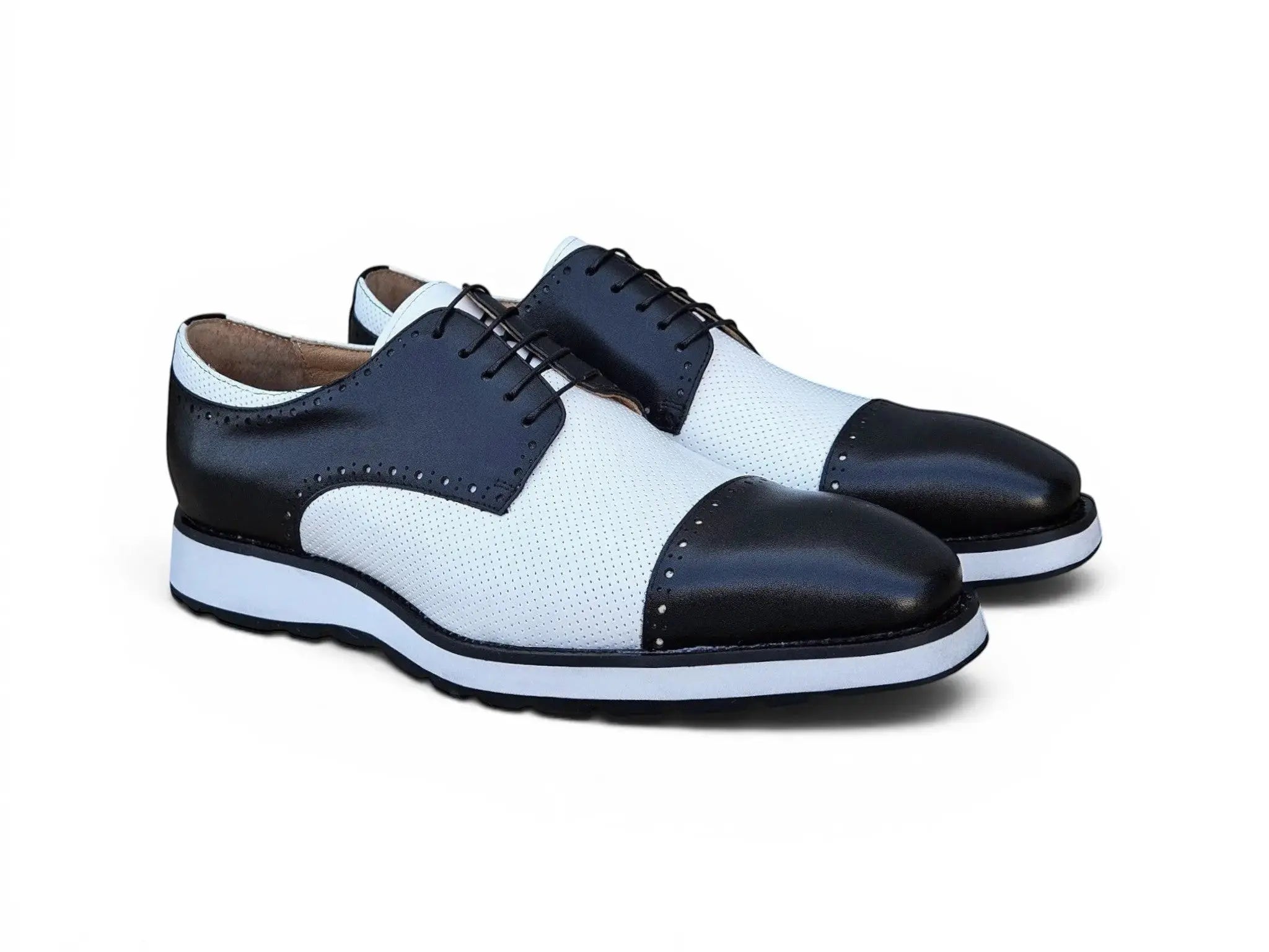 Carrucci Shoes black and white two-tone calfskin leather cap toe Oxford with perforated panels and brogue detailing.